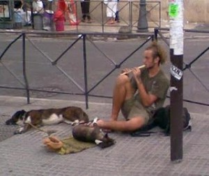 Dirty hippie types that beg with a dog and a flute. Actively protest whatever is being protested.